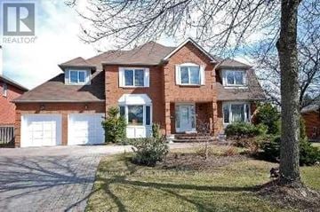 Markham (Unionville) apartment for rent - A large brick house with a white garage door.