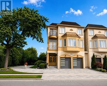 Richmond Hill (Langstaff) apartment for rent - A large, luxurious house with a front yard and a driveway.