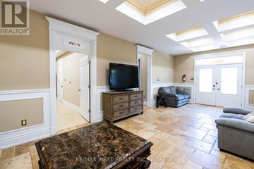 Richmond Hill (Langstaff) apartment for rent - A living room with a brown coffee table and a flat screen TV.