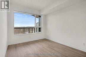 Vaughan (Uplands) condo for rent - A room with a large window and a view of the outdoors.