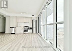 Vaughan (Vaughan Corporate Centre) condo for rent - A modern kitchen with a view of the city.