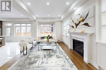 Oakville (Go Glenorchy) apartment for rent - A living room with a fireplace and a rug on the floor.