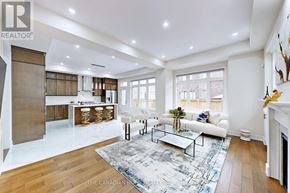 Oakville (Go Glenorchy) apartment for rent - A spacious living room with a fireplace and a large rug.