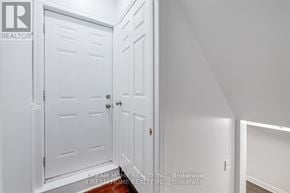 Mississauga (East Credit) apartment for rent - A white door with a handle and a lock is in a room.