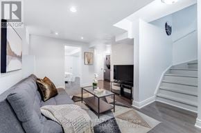 Mississauga (East Credit) apartment for rent - A modern living room with a grey sofa and a glass coffee table.