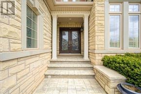 Oakville (Jc Joshua Creek) apartment for rent - A house entrance with a glass door and steps leading up to it.