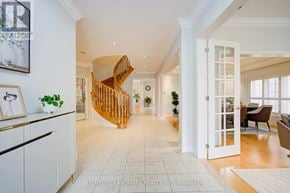 Oakville (Jc Joshua Creek) apartment for rent - A spacious living room with a wooden spiral staircase.