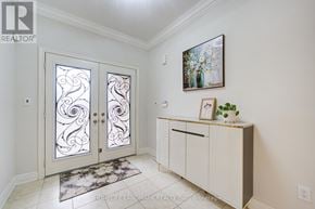 Oakville (Jc Joshua Creek) apartment for rent - A white interior with a glass door and a framed picture on the wall.