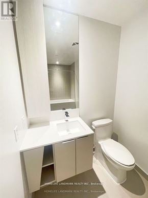 Mississauga (City Centre) condo for rent - A white toilet sits next to a sink in a small bathroom.