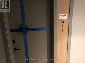 Milton (Cb Cobban) condo for rent - A door with a blue tape and a sign that says 'OCCUPIED' on it.