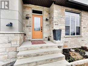 Port Colborne (Sugarloaf) apartment for rent - A house with a brown door and a stone wall.