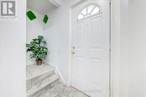 Toronto (Clairlea-Birchmount) apartment for rent - A white door with a gold handle is in a white hallway.