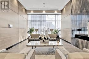 Toronto (Willowdale East) condo for rent - A modern living room with a glass table and chairs.