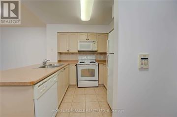 Toronto (Waterfront Communities) condo for rent - A kitchen with a white oven and sink.