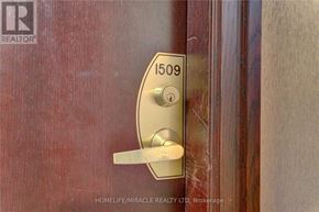 Toronto (Waterfront Communities) condo for rent - A door handle with a lock and a number plate on it.