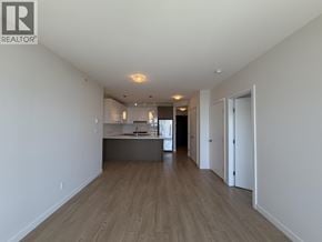 Coquitlam apartment for rent - A spacious room with wooden floors and white walls.