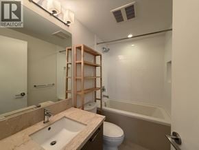 Coquitlam apartment for rent - A bathroom with a sink, toilet, and bathtub.