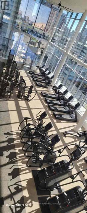 Mississauga (City Centre) condo for rent - A gym with treadmills and elliptical machines.