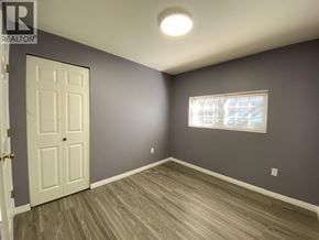 Burnaby apartment for rent - A room with a white door and a window with a white frame.