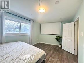Mississauga (Mississauga Valleys) townhouse for rent - A bedroom with a bed, a window, and a door.