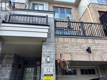 Whitby (Port Whitby) townhouse for rent - A building with a sign that says 52 and Grow Point.