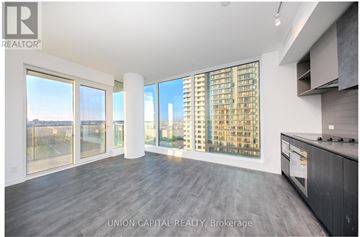 Vaughan (Vaughan Corporate Centre) condo for rent - A spacious kitchen with a view of the cityscape outside the large windows.