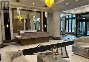 Mississauga (Fairview) condo for rent - A well-lit, modern living room with a large mirror and a marble floor.