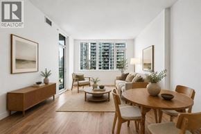 Burnaby apartment for rent - A well-lit, modern dining room with a wooden table and chairs.