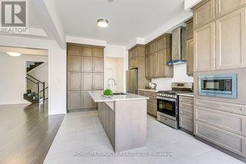 Oakville (Nw Northwest) apartment for rent - A modern kitchen with wooden cabinets and a central island.