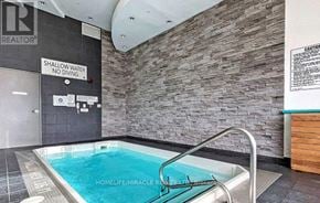Toronto (Bayview Village) condo for rent - A pool with a sign that says shallow water no diving.