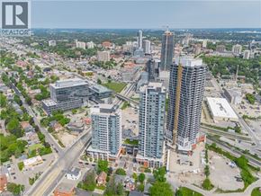 Kitchener condo for rent - A cityscape with a tall building under construction in the foreground.
