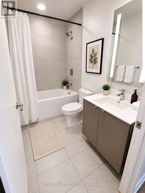 Toronto (Annex) condo for rent - A bathroom with a toilet, sink, and bathtub.