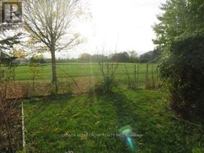 Mississauga (East Credit) apartment for rent - A field with a fence and trees in the distance.
