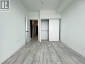 Toronto (Newtonbrook East) condo for rent - A spacious room with a white door and a white wall.