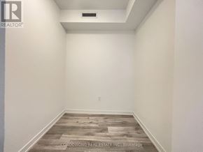 Toronto (Newtonbrook East) condo for rent - A room with a wooden floor and white walls.