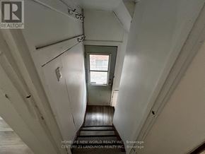 Hamilton (Westdale) apartment for rent - A long hallway with a window at the end.