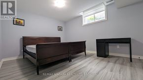 Niagara Falls (Forestview) apartment for rent - A bedroom with a bed, desk, and chair.