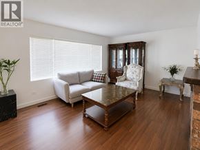 Vancouver apartment for rent - A living room with a wooden floor and furniture.