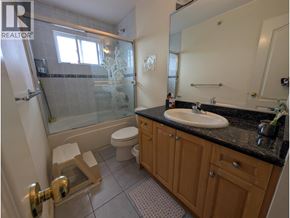 Vancouver apartment for rent - A bathroom with a sink, toilet, and bathtub.