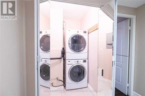 Toronto (Kingsview Village-The Westway) condo for rent - A laundry room with a washer and dryer in it.