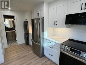 Toronto (Humber Heights) apartment for rent - A kitchen with a refrigerator, oven, and microwave.