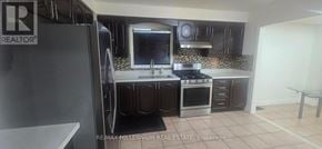 Brampton (Fletcher's West) apartment for rent - A kitchen with a refrigerator and a sink.