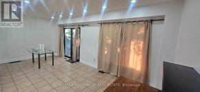 Brampton (Fletcher's West) apartment for rent - A room with a glass table and a glass door leading to a balcony.