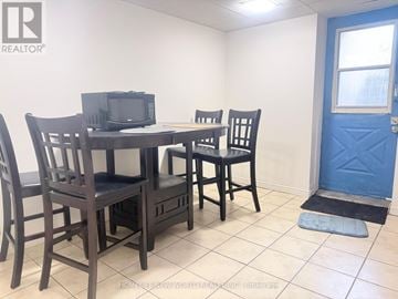 Toronto (Hillcrest Village) apartment for rent - A dining room with a table and chairs.