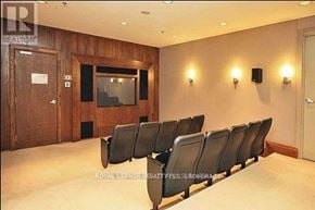 Toronto (University) condo for rent - A room with a row of chairs and a television on the wall.