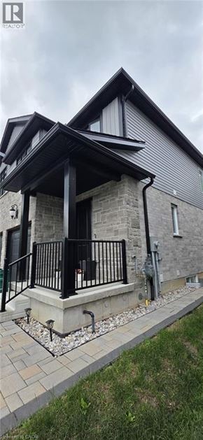 Ayr apartment for rent - A house with a grey roof and a black railing.