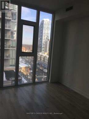 Toronto (Yonge-Eglinton) condo for rent - A room with a view of the city through large windows.