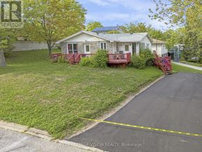 Fort Erie (Central) multi-family for rent - A house with a red front porch is for sale.