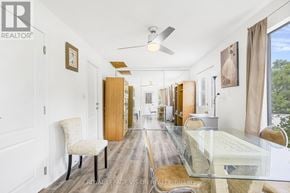 Fort Erie (Central) multi-family for rent - A spacious dining room with a glass table and chairs.
