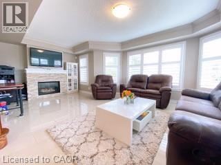 Burlington townhouse for rent - A living room with a white coffee table and brown leather couches.